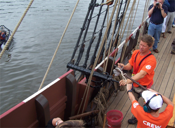 Michael fires a swivel gun salute, as seen from the Quarter deck.