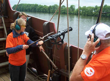 Ms. Crone fires the final swivel gun salute.