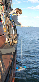 Matt lowers a Van Dorn sampler to the water.