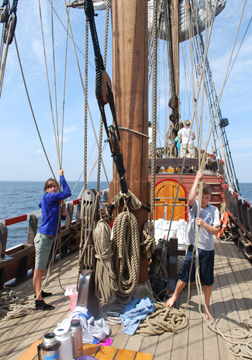 Evi and Nick prepare to overhaul the main course's dowsing lines.