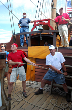 Lisa, Dave, and Jack stand ready at the sheets with the officers behind them.