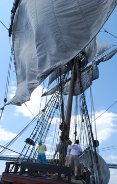 The main course violently luffs in the wind.