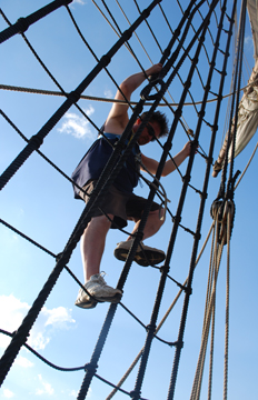 Patrick Wolfe climbs the rig.