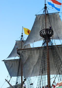 Nick and Evi wave from the mast tops in a wide view.