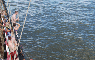 Marco swings into the water.