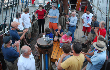 The crew applauds Betsy Keanen.