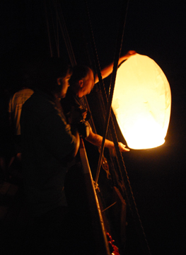 Captain Reynolds releases a Chinese lantern.