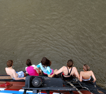 Brian, Evi, Nora, Rachel, and Nick -- all but one -- leap off the fore channel.