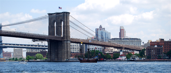 The Half Moon travels under the Brooklyn Bridge.
