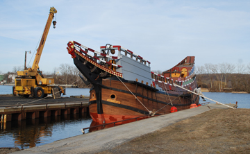 The mastless Half Moon safely docked in the boat launch.