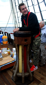 Kees rides the capstan as it slowly spins.