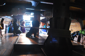 Students tend the anchor rode as it passes around the lower capstan.