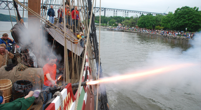 Mr. McGuigan and Ms. Laufer unleash a pillar of flame with the swivel gun.