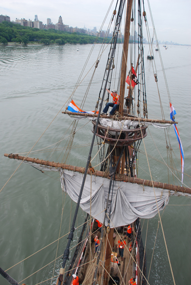 Mr Karn mans the main top as the Half Moon leads a flotilla of heritage vessels past the upper Manhattan waterfront