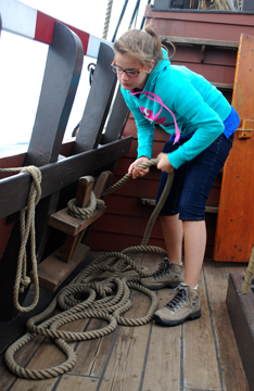 Jeanine belays the main course tack.