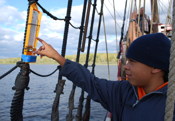 Cassie checks the hygrometer.