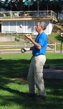 Mr. Garfinkel juggles on shore.