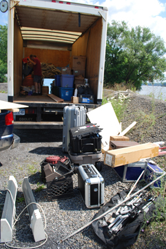 Equipment is piled up outside the ship's box truck.