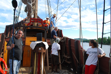Mr. Cardoza waits with the boom mic while Captain Reynolds issues orders from the Quarter deck.