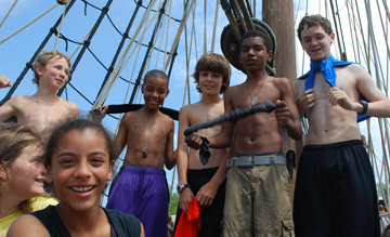 Abby, Alanna, Nick, Tahari, Matt G., Jason, and Jack relax on the fore deck.