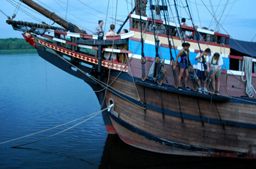 Mr. Linehan works with Alanna and Vincent on the port fore channel as the sun sets.