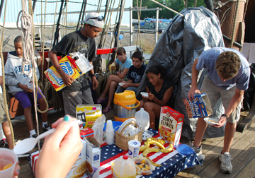The crew eats breakfast on the weather deck.