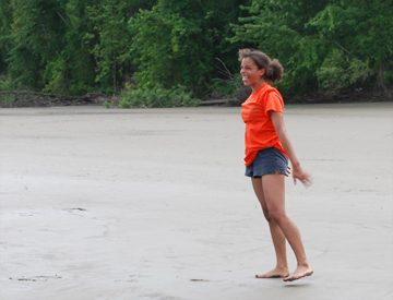 Alanna does a flip on the beach.