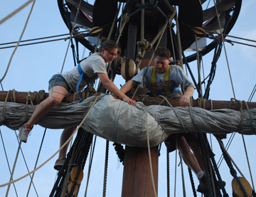 Ms. Laufer and Mr. Weisse furl the main course.