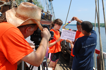 Matt B. snaps the clapboard on a shot of Nora and Tahari.