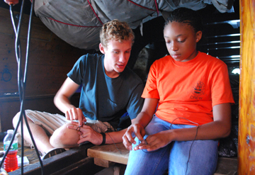 Mr. Boyle teaches Raynika a new knot.