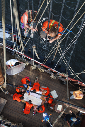 Mr. Woodworth tapes a scene of the students from the rigging.