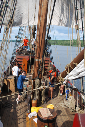 The students man the sails.