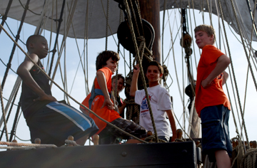 Deniro, Matt G., Vincent, and Alex pose dramatically on the fore deck while lookout Nick looks on.