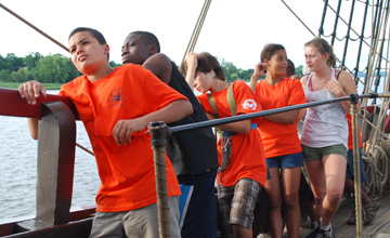 Matt B., Deniro, Matt G., Alanna, andAbby hang out at the rail.