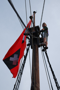 Nick fixes the Amsterdam flag atop the mizzen mast.