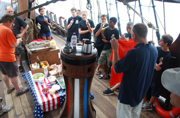 Captain Reynolds reveals Jack's official crew t-shirt.