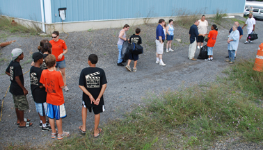 Students rejoin their families on shore.