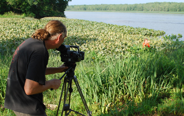 Mr. Woodworth films Nick in wetlands alongside Athens Channel.