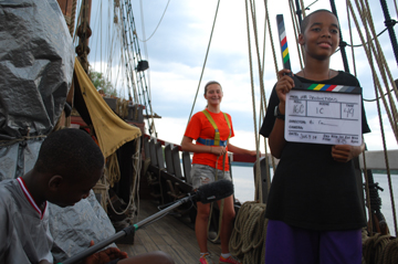 "Boomer" Deniro and "Clapper" Tahari set up a shot with segment host Abby.