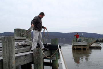 Greg Weiss heave a monkey's fist across the dock opening to Pauli Dangerousli.