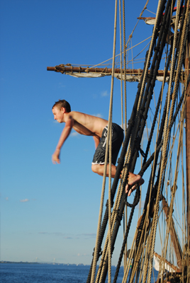 Nick jumps into the water from the rig.