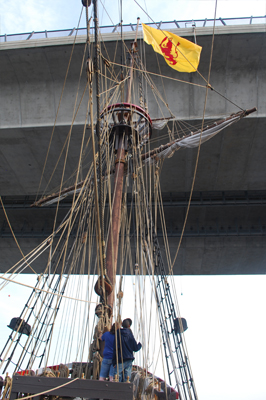 The Half Moon's foremast approaches a low bridge.