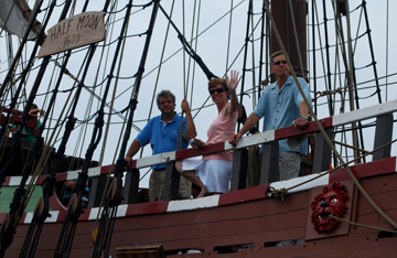 Eliu and Bob Hansen zip away from the Half Moon as guests wave from on deck.